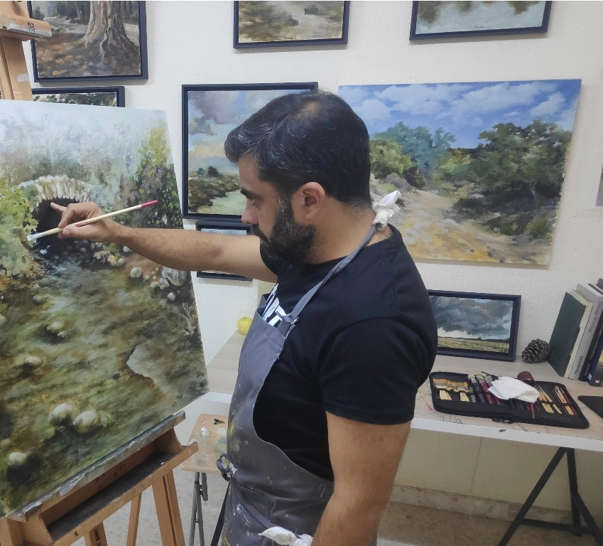 Juan Camacho pintando